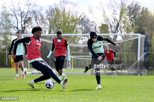 Josh-Kofi Acheampong and Cole Palmer of Chelsea during a training session at Chelsea Training Ground on April 3, 2024 in Cobham, England.