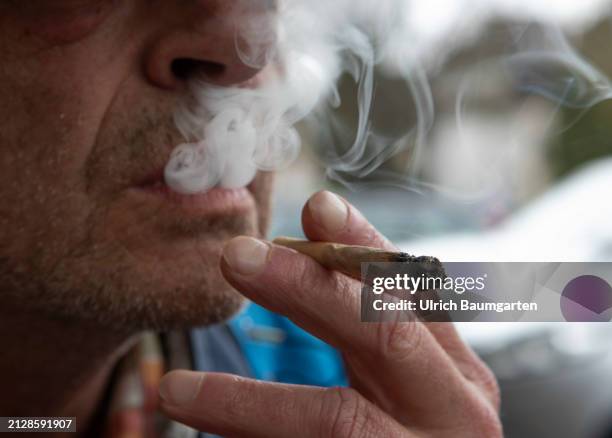 Man smokes a cannabis joint on April 03, 2024 in Bonn, Germany. Cannabis cultivation and consumption was permitted in Germany from April 1, 2024.