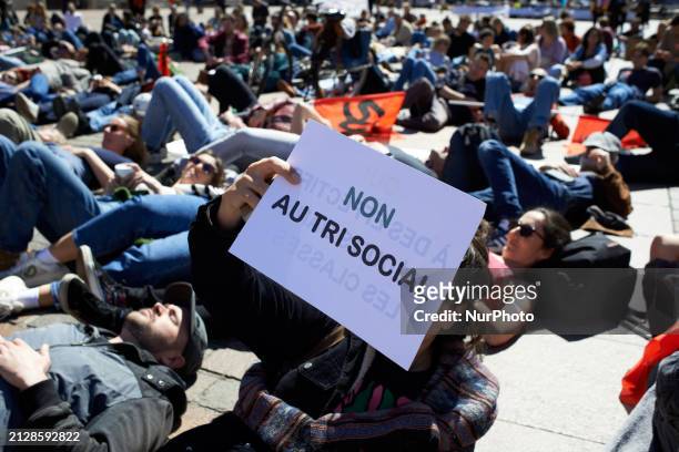 Teacher is holding a sign that reads 'No to social selecting' during a die-in in Toulouse, France, on April 2, 2024. All unions have called for a day...
