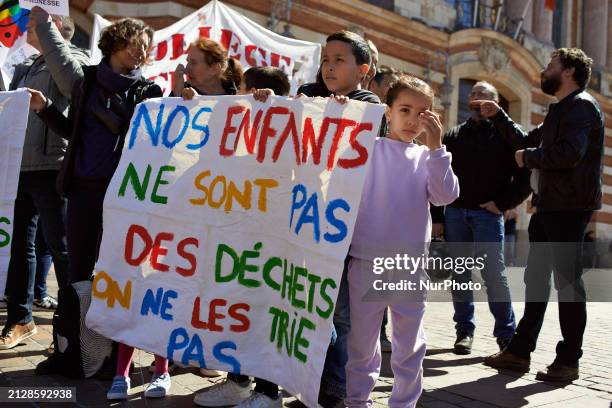 Children are holding a sheet that reads 'Our children aren't garbage, we won't select them'. All unions have called for a day of strike and protest...