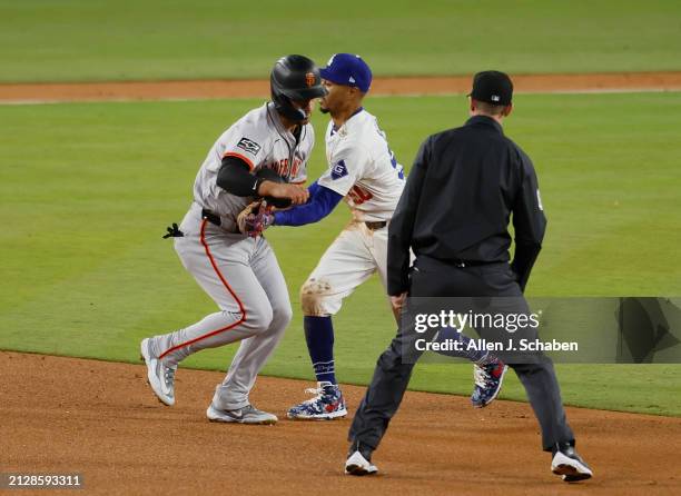 Los Angeles, CA With Wilmer Flores batting, Giants Michael Conforto, #8 left, is picked off and caught stealing 2nd base by Dodgers' Mookie Betts,...