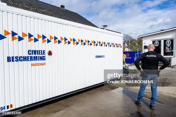 Police activity is seen at the site where three people were found dead in a drug lab in Poederlee near Lille, Antwerp province, Belgium, Wednesday 03...