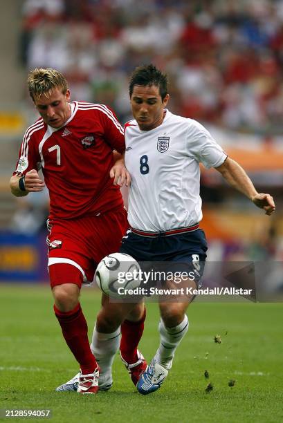 June 15: Chris Birchall of Trinidad and Frank Lampard of England challenge during the FIFA World Cup Finals 2006 Group B match between England and...