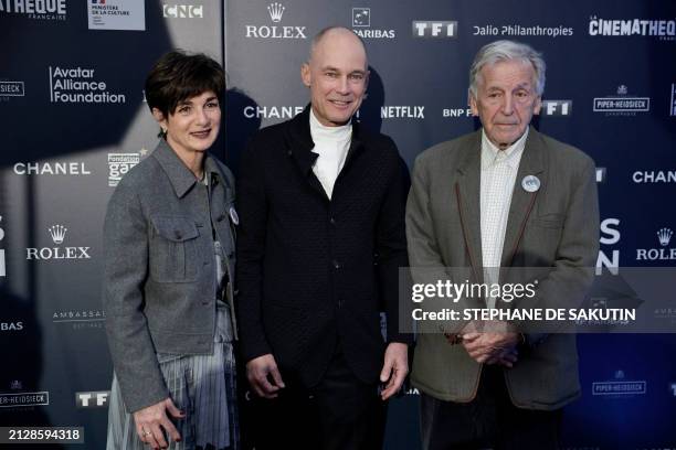 French-Greek screenwriter, director and President of the Cinematheque Francaise, Costa Gavras poses with Swiss psychiatrist and aeronaut Bertrand...