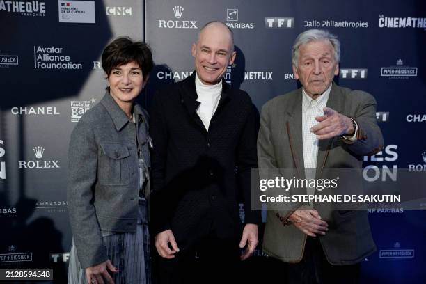 French-Greek screenwriter, director and President of the Cinematheque Francaise, Costa Gavras poses with Swiss psychiatrist and aeronaut Bertrand...