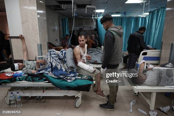 Injured Palestinians receive treatment at the Shuhada al-Aqsa Hospital in Deir el-Balah in the central Gaza Strip on April 3 amid the ongoing...