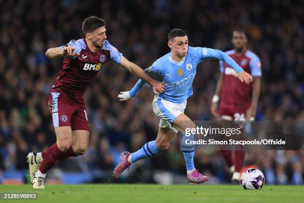 Clement Lenglet of Aston Villa battles with Phil Foden of Manchester City during the Premier League match between Manchester City and Aston Villa at...