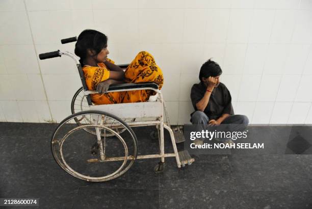 Patients wait in the outpatient ward of the Government Gandhi Hospital as Indian junior doctors boycott their outpatient duties in Hyderabad on...