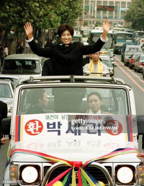 Golfer Pak Seri waves from a car in her hometown of Taejon 28 October as she receives a hero's welcome on her return. Pak has had a remarkable rookie...