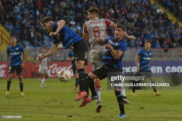 Huachipato's defender Benjamin Gazzolo and Estudiantes's defender Federico Fernandez fight for the ball during the Copa Libertadores group stage...