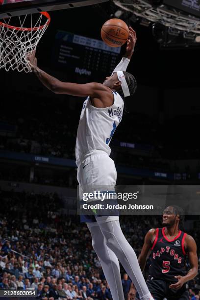 Jaden McDaniels of the Minnesota Timberwolves dunks the ball during the game against the Toronto Raptors on April 3, 2024 at Target Center in...