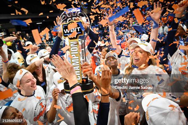 Illinois Fighting Illini players, coaches, and fans celebrate after winning the WBIT Finals game against the Villanova Wildcats at Hinkle Fieldhouse...