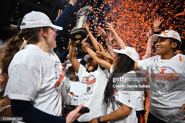 Illinois Fighting Illini players, coaches, and fans celebrate after winning the WBIT Finals game against the Villanova Wildcats at Hinkle Fieldhouse...