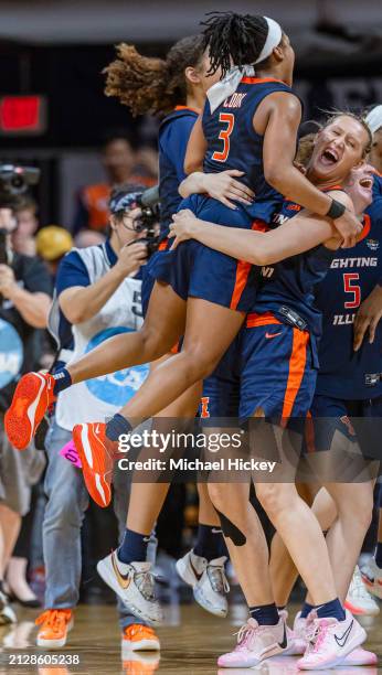 Makira Cook and Shay Bollin of the Illinois Fighting Illini celebrate following the game against the Villanova Wildcats in the Women's Basketball...