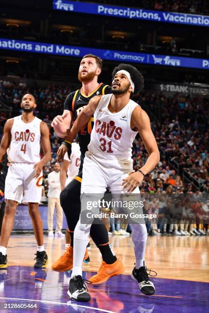 Jarrett Allen of the Cleveland Cavaliers boxes out Jusuf Nurkic of the Phoenix Suns during the game on April 3, 2024 at Footprint Center in Phoenix,...