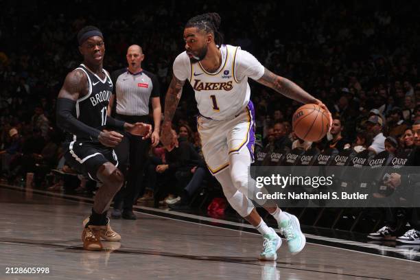 Angelo Russell of the Los Angeles Lakers handles the ball against Dennis Schroder of the Brooklyn Nets during the game on March 31, 2024 at Barclays...