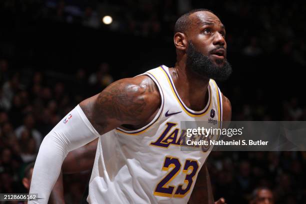 LeBron James of the Los Angeles Lakers looks on during the game against the Brooklyn Nets on March 31, 2024 at Barclays Center in Brooklyn, New York....