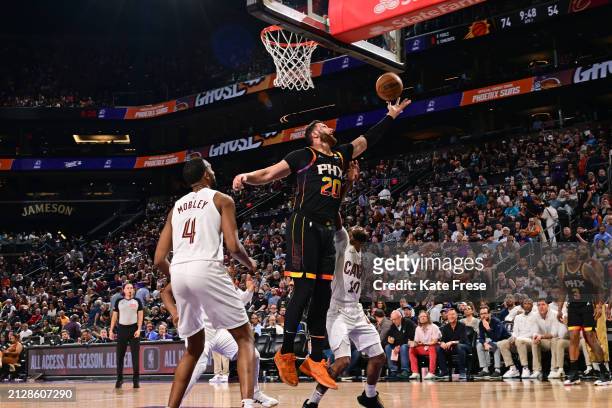 Jusuf Nurkic of the Phoenix Suns rebounds the ball during the game against the Cleveland Cavaliers on April 3, 2024 at Footprint Center in Phoenix,...