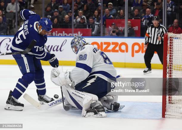 Toronto Maple Leafs right wing Ryan Reaves tries to get a rebound past Tampa Bay Lightning goaltender Andrei Vasilevskiy as the Toronto Maple Leafs...