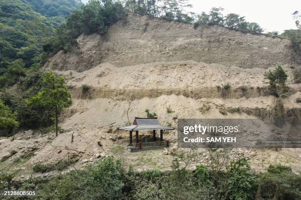 This photo shows a damaged pavilion covered in the mud at the Taroko National Park after an earthquake in Hualien on April 4, 2024. At least nine...