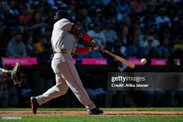 Masataka Yoshida of the Boston Red Sox bats during the game against the Seattle Mariners at T-Mobile Park on March 31, 2024 in Seattle, Washington....