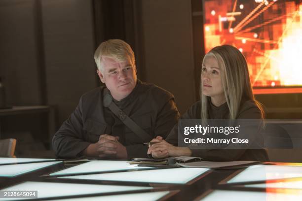 Actors Philip Seymour Hoffman and Julianne Moore on the set of the film "The Hunger Games: Mockingjay Part II", Atlanta, USA, 2013. {Photo by Murray...