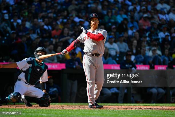 Masataka Yoshida of the Boston Red Sox bats during the game against the Seattle Mariners at T-Mobile Park on March 31, 2024 in Seattle, Washington....