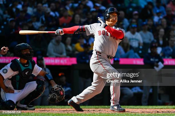 Masataka Yoshida of the Boston Red Sox bats during the game against the Seattle Mariners at T-Mobile Park on March 31, 2024 in Seattle, Washington....