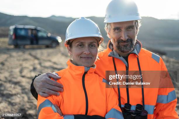 portrait of field biologists team. - business mature couple portrait stock pictures, royalty-free photos & images