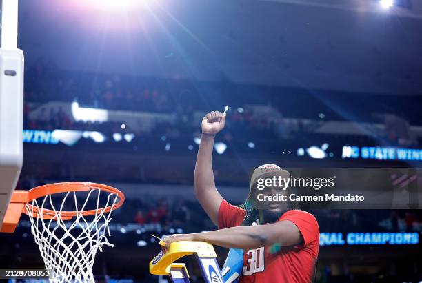 Burns Jr. #30 of the North Carolina State Wolfpack cuts down the net after the Wolfpack defeated the Duke Blue Devils to advance to the Final Four...