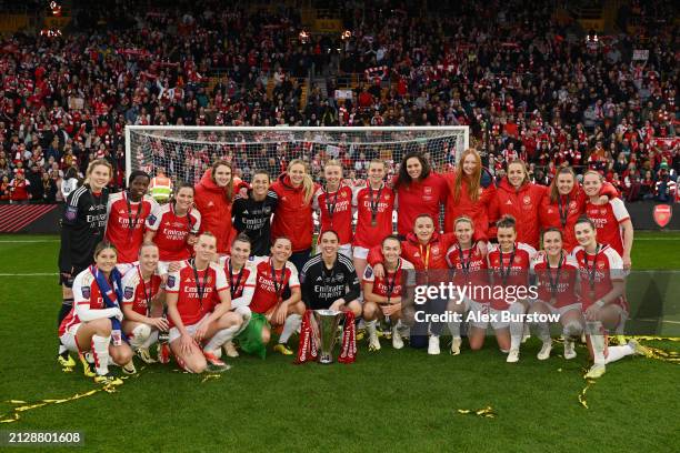 The Arsenal team celebrate with the trophy in front of the Arsenal fans after winning the FA Women's Continental Tyres League Cup Final match between...