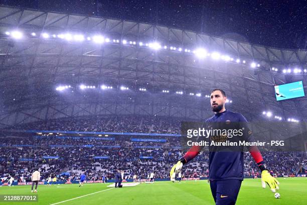 Gianluigi Donnarumma of Paris Saint-Germain warms up before the Ligue 1 Uber Eats match between Olympique de Marseille and Paris Saint-Germain at...
