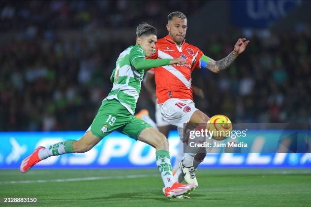 Santiago Munoz of Santos fights for the ball with Francisco Calvo of Juarez during the 13th round match between FC Juarez and Santos Laguna as part...