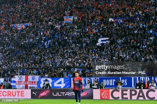 Kylian Mbappe of Paris Saint-Germain looks on during warmup before the Ligue 1 Uber Eats match between Olympique de Marseille and Paris Saint-Germain...