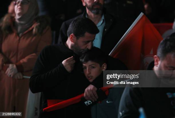 Supporters listen as President Recep Tayyip Erdoğan speaks at AK Party headquarters on local government elections March 31, 2024 in Ankara, Turkey....