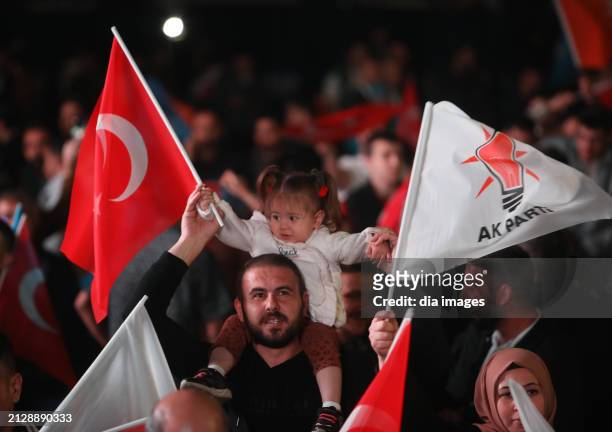 Supporters listen as President Recep Tayyip Erdoğan speaks at AK Party headquarters on local government elections March 31, 2024 in Ankara, Turkey....