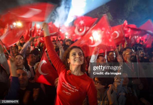 Supporters celebrate as Ekrem İmamoğlu speaks after his re-election as the chairman of the Istanbul Metropolitan Municipality at the CHP Istanbul...