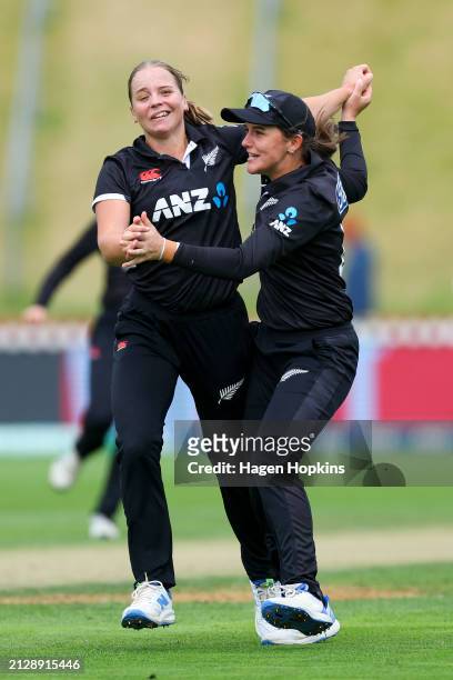 Jess Kerr of New Zealand celebrates with Amelia Kerr after taking the wicket of Heather Knight of England during game one of the Women's ODI series...