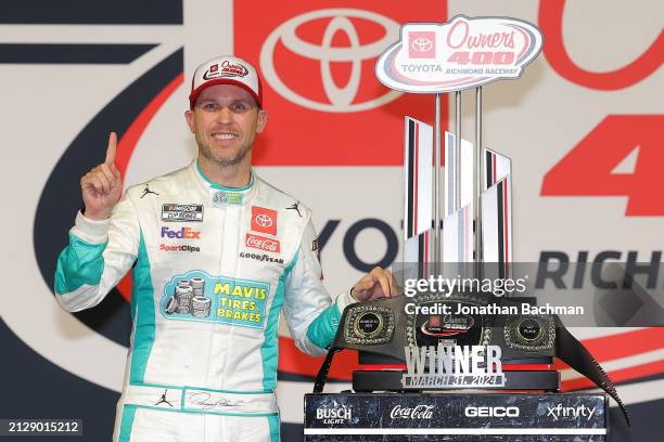 Denny Hamlin, driver of the Mavis Tires & Brakes Toyota, celebrates in victory lane after winning the NASCAR Cup Series Toyota Owners 400 at Richmond...