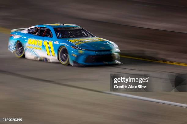 Denny Hamlin, driver of the Mavis Tires & Brakes Toyota, drives during the NASCAR Cup Series Toyota Owners 400 at Richmond Raceway on March 31, 2024...