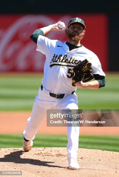 Paul Blackburn of the Oakland Athletics pitches against the Cleveland Guardians in the top of the first inning on March 31, 2024 at the Oakland...