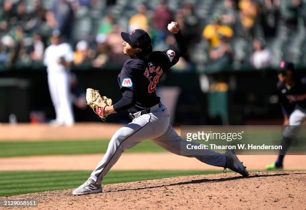 Eli Morgan of the Cleveland Guardians pitches against the Oakland Athletics in the bottom of the ninth inning on March 31, 2024 at the Oakland...