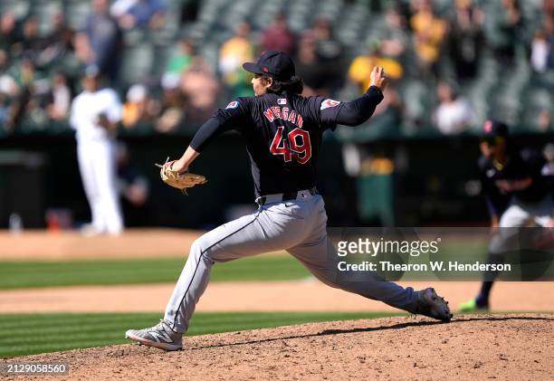 Eli Morgan of the Cleveland Guardians pitches against the Oakland Athletics in the bottom of the ninth inning on March 31, 2024 at the Oakland...