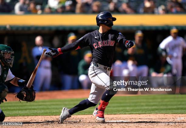 Andres Gimenez of the Cleveland Guardians bats against the Oakland Athletics in the top of the ninth inning on March 31, 2024 at the Oakland Coliseum...