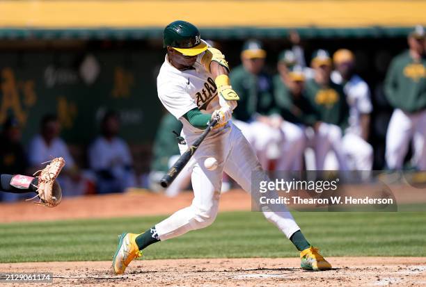 Esteury Ruiz of the Oakland Athletics hits a triple against the Cleveland Guardians in the bottom of the third inning on March 31, 2024 at the...