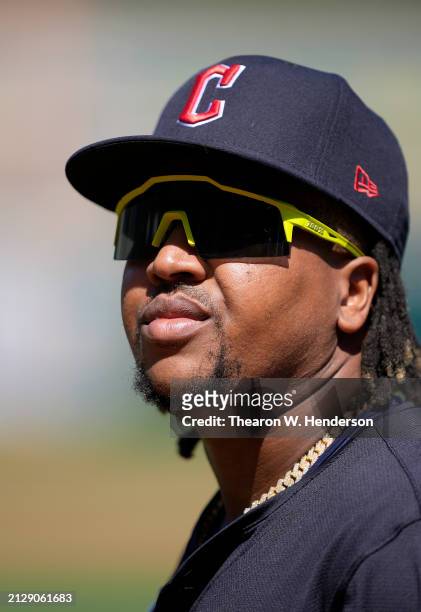 Jose Ramirez of the Cleveland Guardians looks on walking back to the dugout prior to the start of the game against the Oakland Athletics on March 31,...
