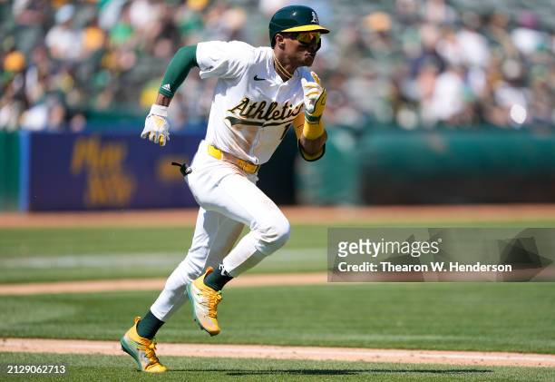 Esteury Ruiz of the Oakland Athletics races around the bases on his way to a triple against the Cleveland Guardians in the bottom of the third inning...