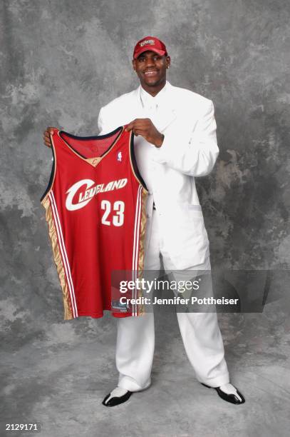 LeBron James who was selected first overall by the Cleveland Cavaliers poses for a portrait during the 2003 NBA Draft at the Paramount Theatre at...