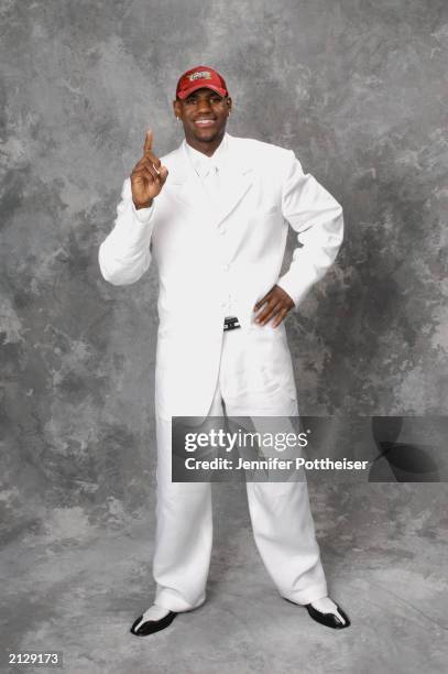 LeBron James who was selected first overall by the Cleveland Cavaliers poses for a portrait during the 2003 NBA Draft at the Paramount Theatre at...