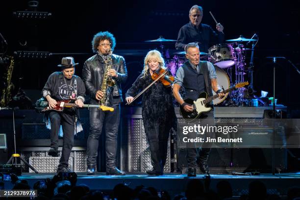 Guitarist Nils Lofgren, saxophonist Jake Clemons, violinist Soozie Tyrell and singer, songwriter and guitarist Bruce Springsteen perform live on...